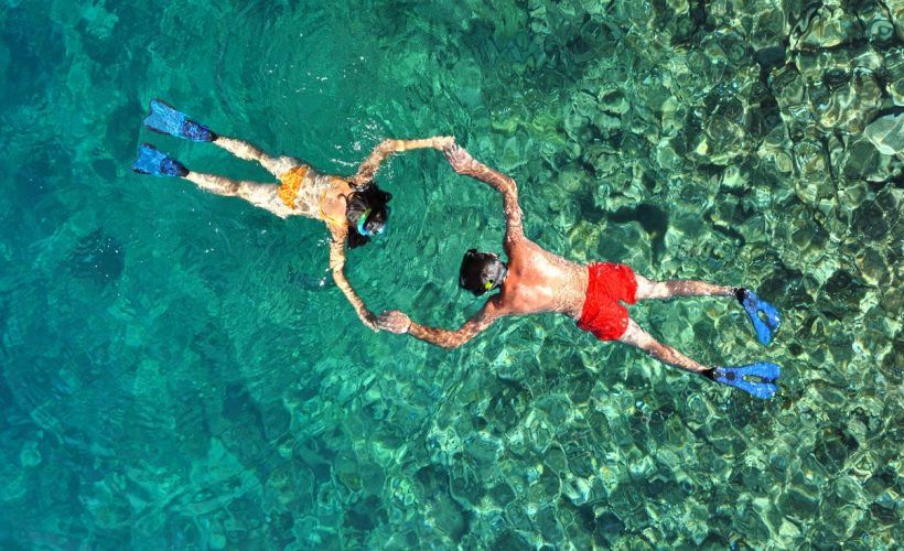 Romantic couple snorkeling in Phi Phi island, Thailand