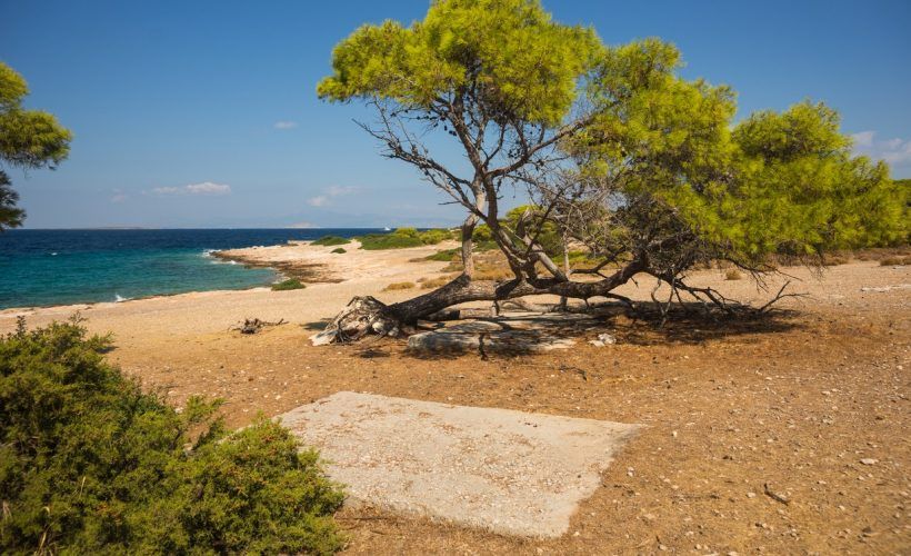 Sea shore and sandy beach of the island  Moni, Saronida, Greece
