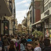 ATHENS, GREECE - MAY 10, 2014: Athenians and tourists in center of city. Tourism is a decisive sector of hope for Greek economy - In the year Greece receives about 18 million tourists.