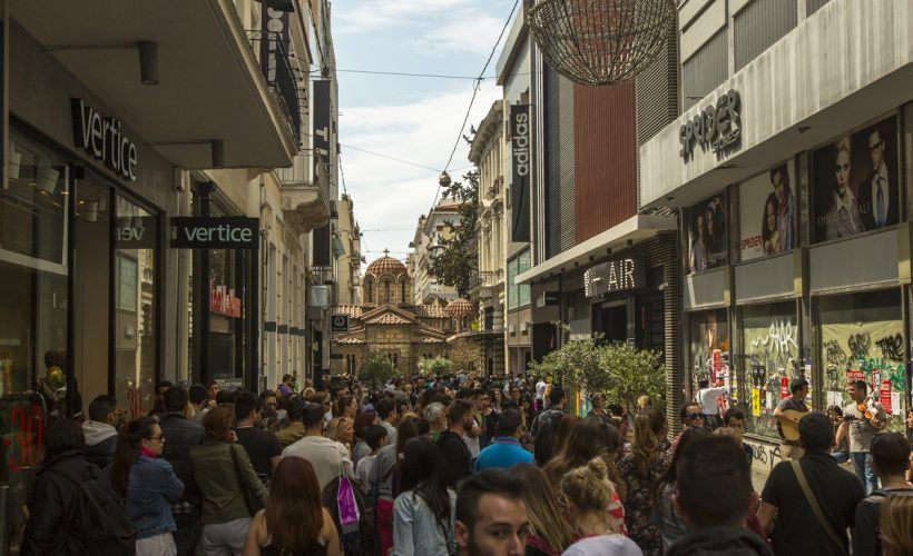 ATHENS, GREECE - MAY 10, 2014: Athenians and tourists in center of city. Tourism is a decisive sector of hope for Greek economy - In the year Greece receives about 18 million tourists.