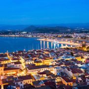 Nafplio aerial panoramic view from Palamidi fortress at night. Nafplio is a seaport town in the Peloponnese peninsula in Greece.