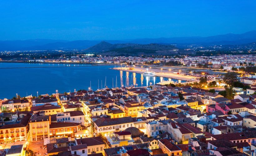 Nafplio aerial panoramic view from Palamidi fortress at night. Nafplio is a seaport town in the Peloponnese peninsula in Greece.