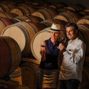 Tourism – Couple tasting wine in a cellar